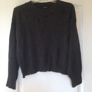 Size medium lightweight sweater top with distressed detailing.